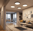Pair of EvokLiving smart ceiling lights, modern LED fixtures with sleek designs mounted on a ceiling for ambient lighting.