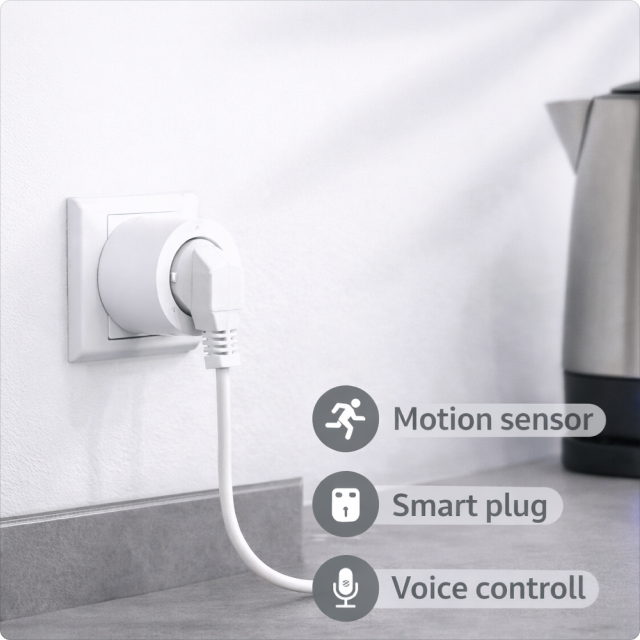 EvokLiving smart plug EU/UK version plugged into wall socket, showing compact design and control switch for home automation.