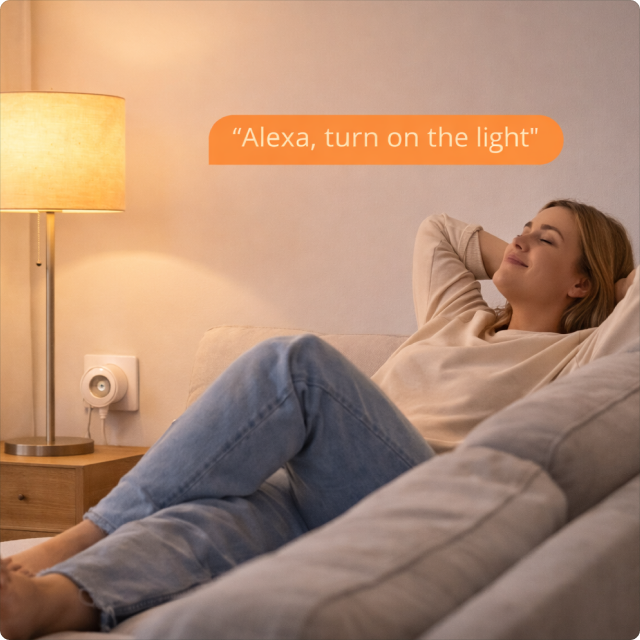 EvokLiving smart plug EU/UK version plugged into a wall socket, showcasing compact design and connectivity features.