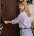 EvokLiving Smart Door Lock T100 with pin keypad, silver finish, and sleek design for secure keyless entry on a modern door.