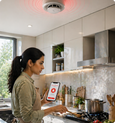 EvokLiving smoke detector mounted on ceiling with alert indicator and sensor, designed for home safety and fire prevention.