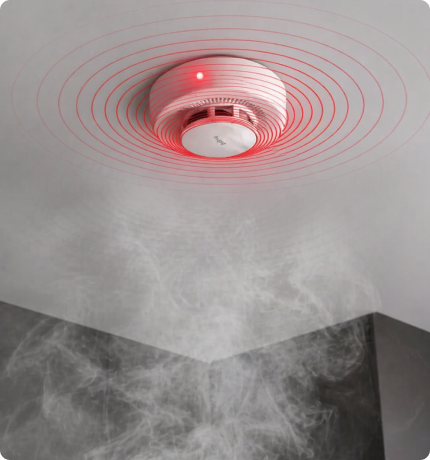 EvokLiving smoke detector mounted on ceiling, compact safety device with alert indicator and sensor for smoke detection.