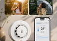 EvokLiving smoke detector mounted on ceiling, with round white design and sensor grille, for home safety and fire alert.