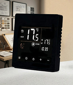 Black smart programmable thermostat with digital touchscreen display showing room temperature control for home heating and energy saving