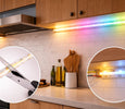 EvokLiving Smart LED strip light displaying colorful ambient lighting on a modern wall.